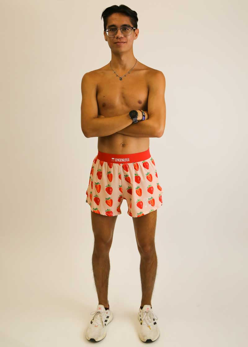 Full body shot of runner wearing the ChicknLegs Strawberry Szn 4 inch running shorts.