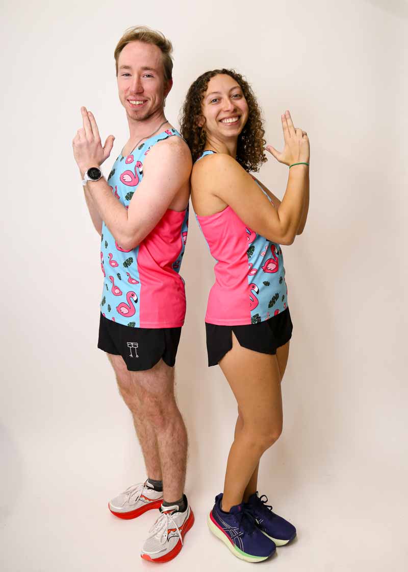 James Bond pose wearing the blue flamingo running singlets from ChicknLegs.