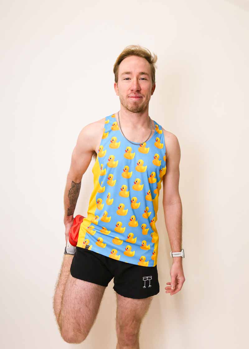 Runner stretching while wearing the ChicknLegs men's rubber ducky singlet.