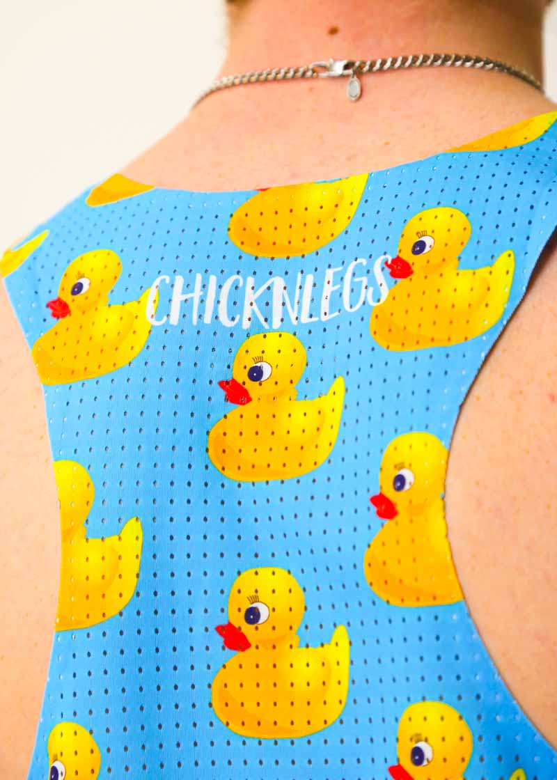 Closeup view of the perforated mesh paneling on the back of the rubber ducky performance singlet.