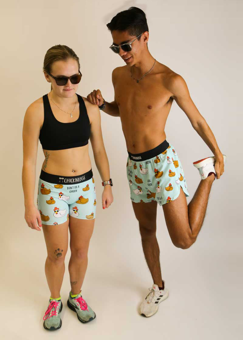 Runners stretching while wearing sunglasses and the swaggy chickns running shorts.