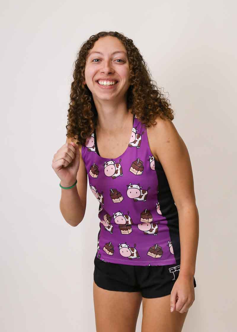 Runner wearing ChicknLegs split shorts and choccy cows performance running singlet.