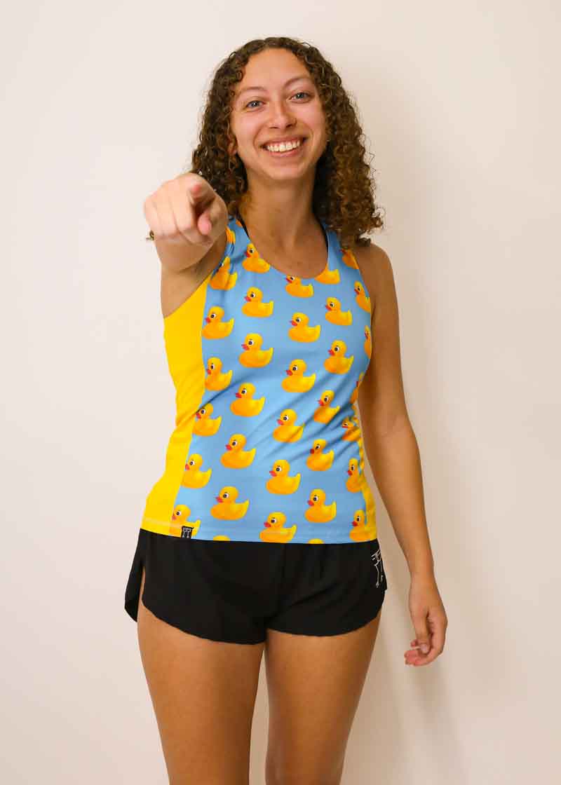 Runner pointing at the camera while wearing the women's rubber ducky performance singlet.