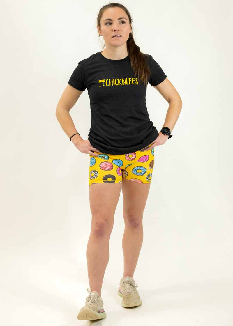 Full body shot of the women's triblend performance tee paired with the 3" donuts compression running shorts.