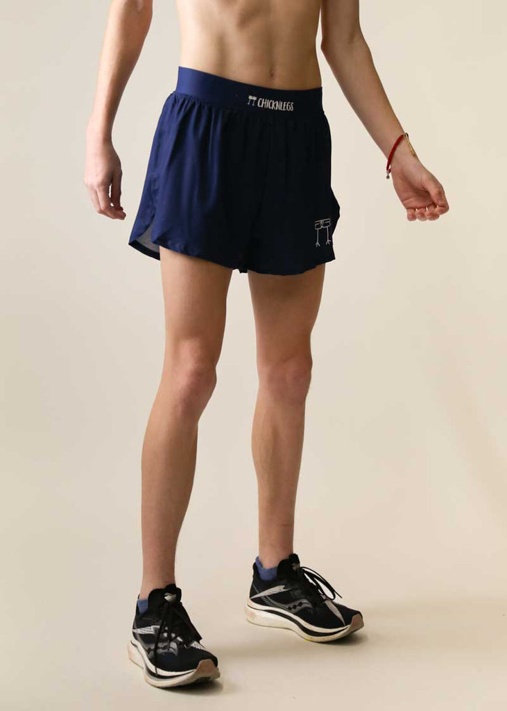 Side view of the men's navy blue 4 inch split shorts.