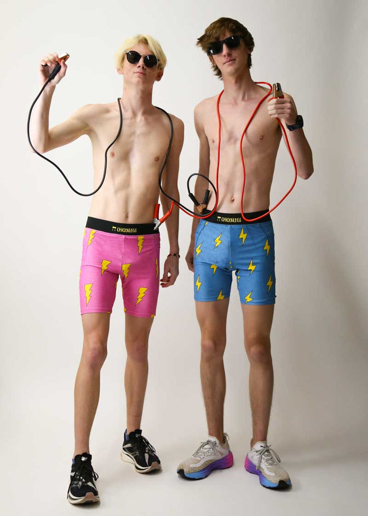 Runners wearing the electrifying pink and blue bolts half tights while hooked up to jumper cables.