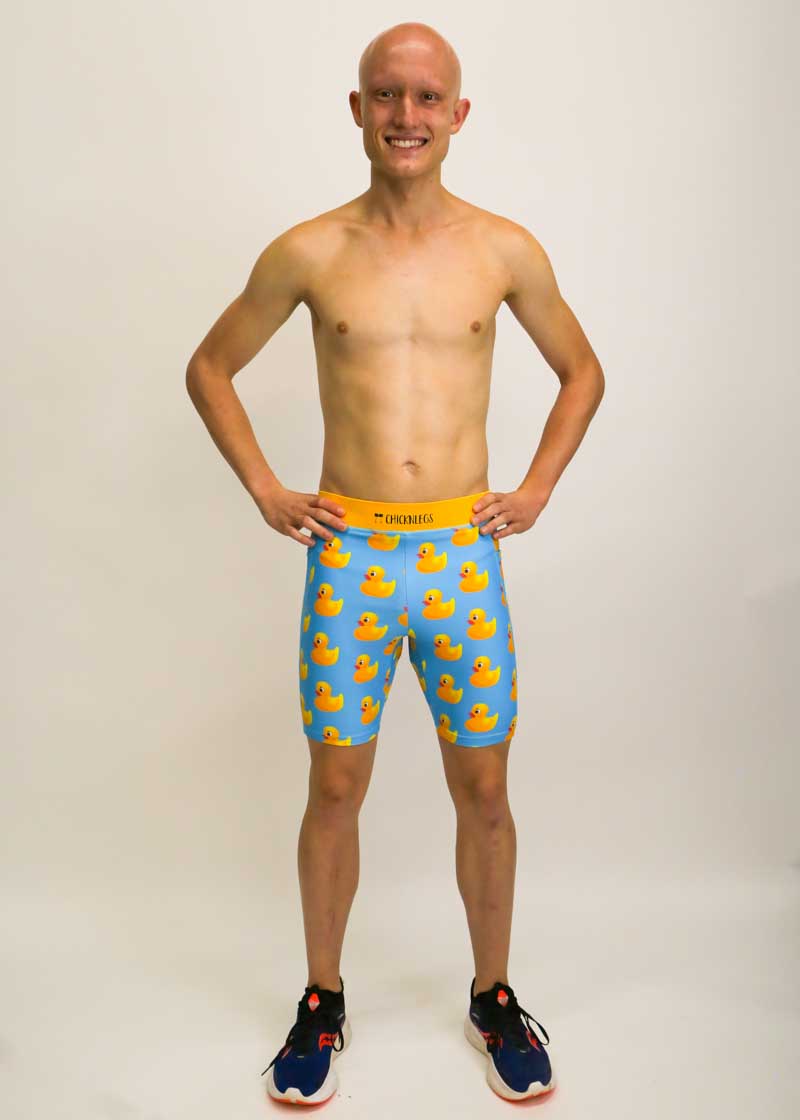 Runner wearing the men's 8 inch rubber ducky half tights full body shot.