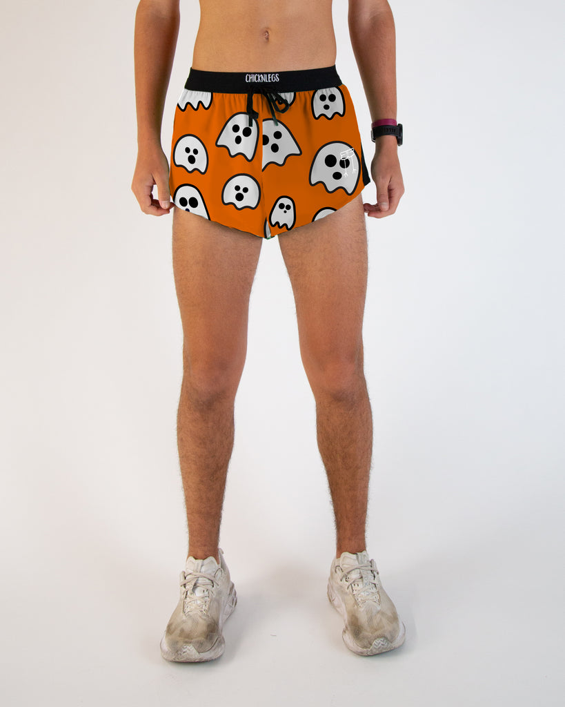 Runner is wearing ChicknLegs in the men's 2 in drawstring split running shorts in the Halloween Ghost design. It has orange, black and white all over it with tons of ghosts.