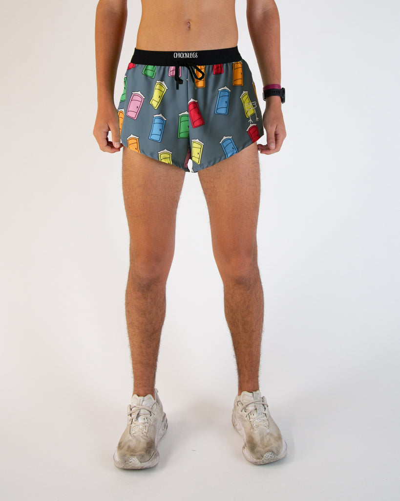 Runner is wearing ChicknLegs in the men's 2 in drawstrings in the split running shorts in the porta potty design. The print has yellow, blue, green, red, orange and pink all over it.