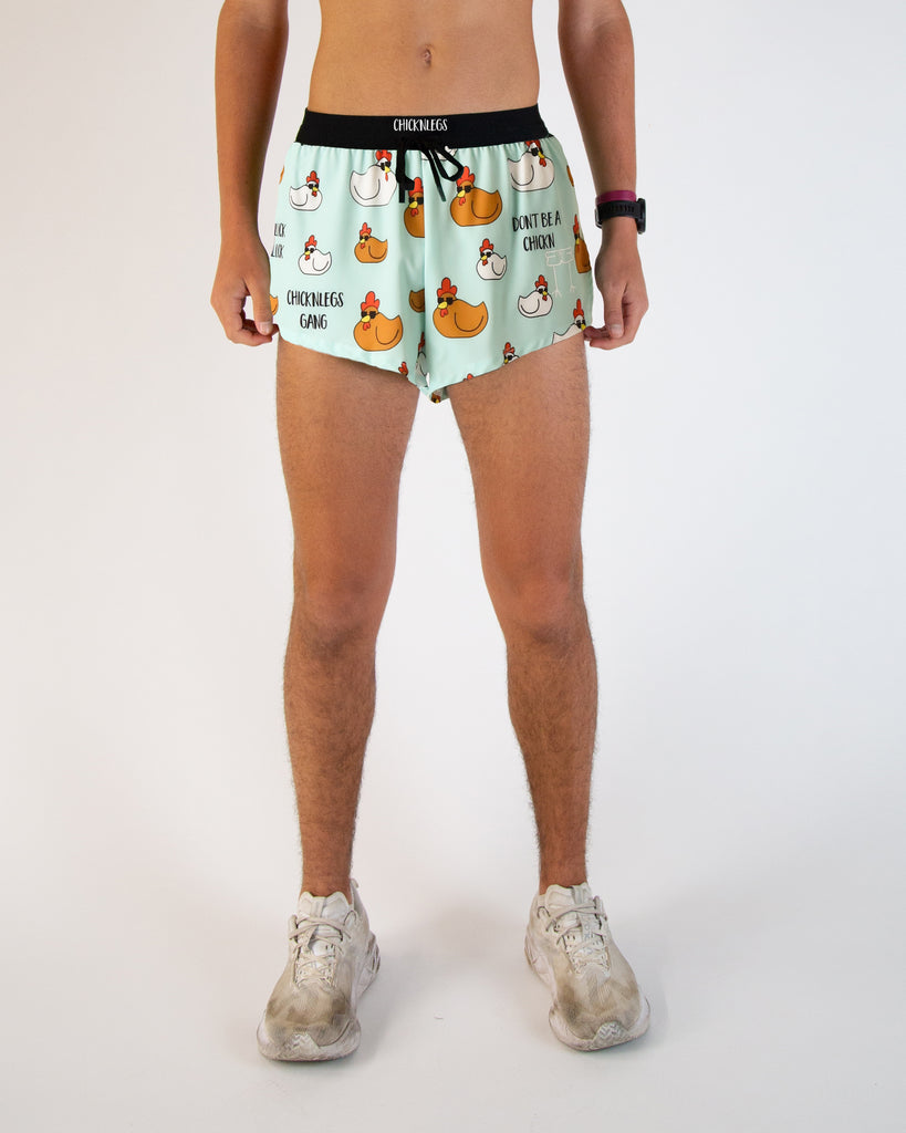 Runner is wearing ChicknLegs in the men's 2 in drawstrings in the split running shorts. The print has brown and white chickens on it for their Swaggy Chickn print.