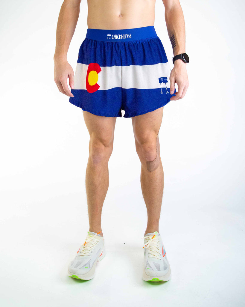 Front view of ChicknLegs men’s 4-inch split running shorts featuring a soft elastic waistband for a secure, smooth fit and black mesh liner for comfort and coverage. Featured are the Colorado State Flag in red, white, yellow and blue!