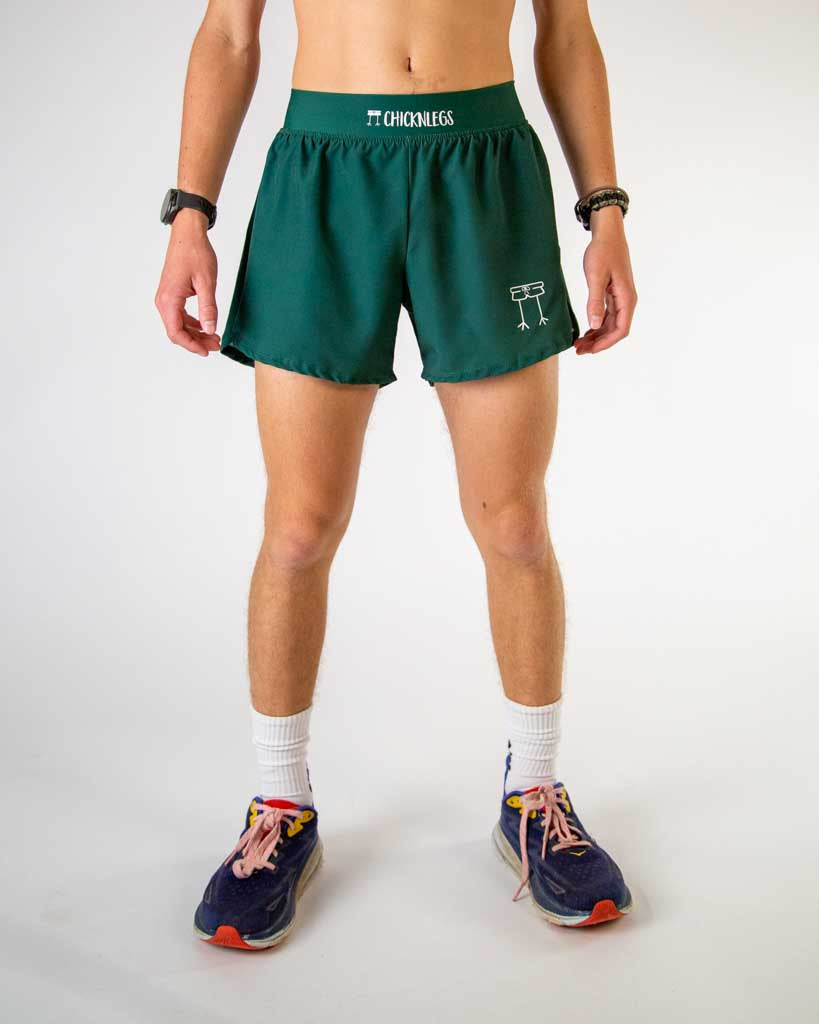 Front view of ChicknLegs men’s 4-inch split running shorts, breathable liner, solid forest green design.