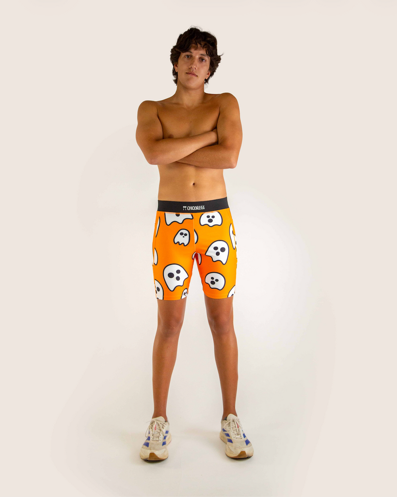 Full body view of model wearing ChicknLegs Men’s 8-inch Half Tights with soft elastic waistband, dual side pockets, internal key pocket, and black mesh liner for support and chafe-free performance.