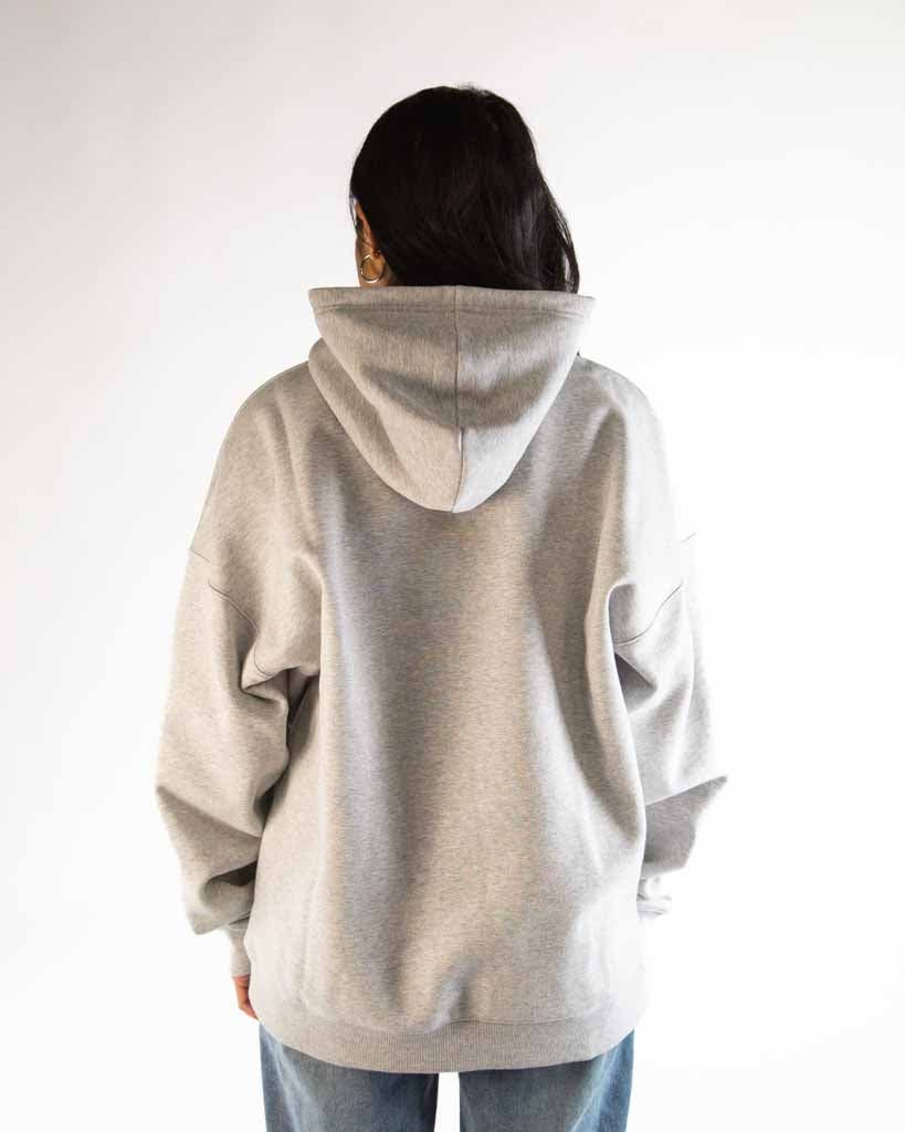Back view of ChicknLegs Varsity Oversized Unisex Hoodie showcasing the loose unisex fit and midweight fabric suitable for everyday wear.