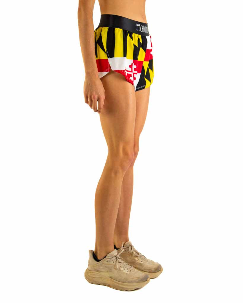 Right side view of ChicknLegs Women’s 1.5-inch split running shorts highlighting the soft elastic waistband, breathable black mesh liner, and athletic side split.