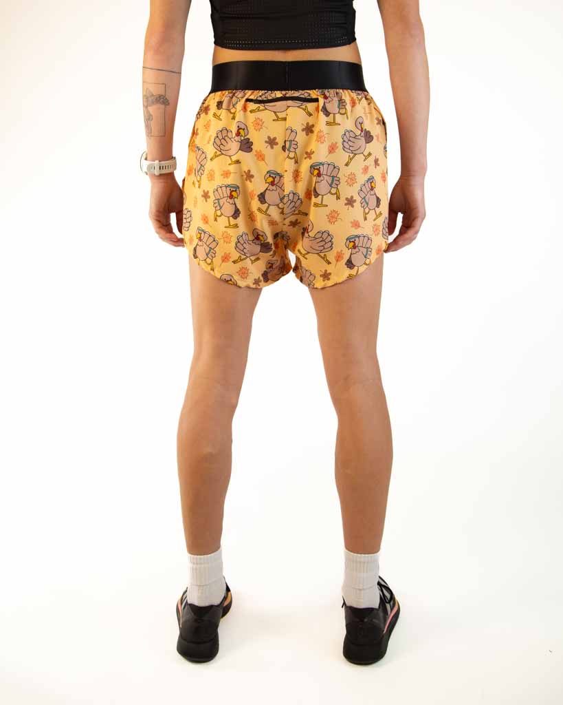 Back view of ChicknLegs Women’s 4-inch split running shorts showcasing the rear zipper pocket for essentials and elastic waistband that provides a secure, comfortable fit.