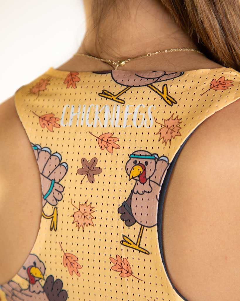 Close-up detail of ChicknLegs Performance Running Singlet fabric, showing lightweight material, seamless stitching, and mesh texture for breathability.
