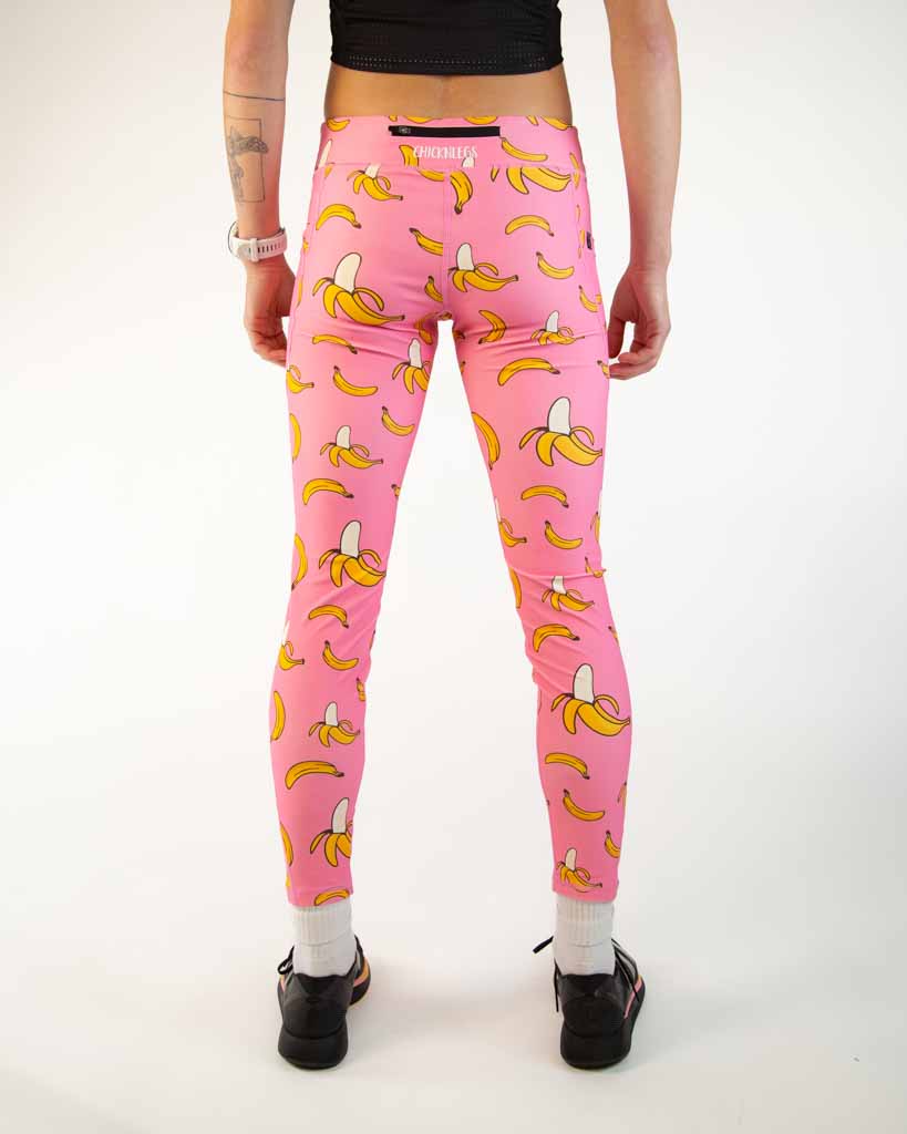 Back view of ChicknLegs Women’s Leggings showcasing the back zipper pocket for storage, mid-rise waistband with adjustable drawstring, and 26-inch length for a supportive running fit.