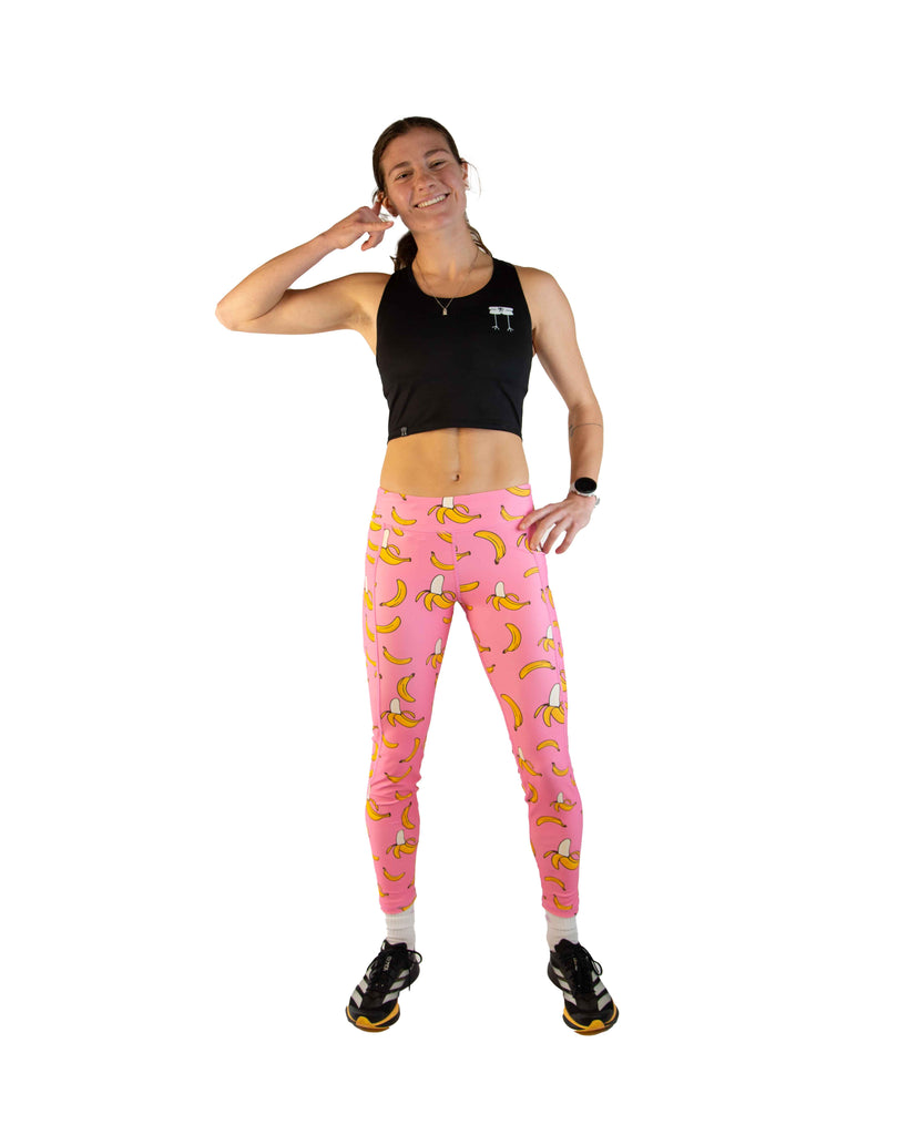 Full body view of model wearing ChicknLegs Women’s Leggings featuring a mid-rise 26-inch length, two side pockets, back zipper pocket, and buttery-soft performance fabric for comfort without chafing.