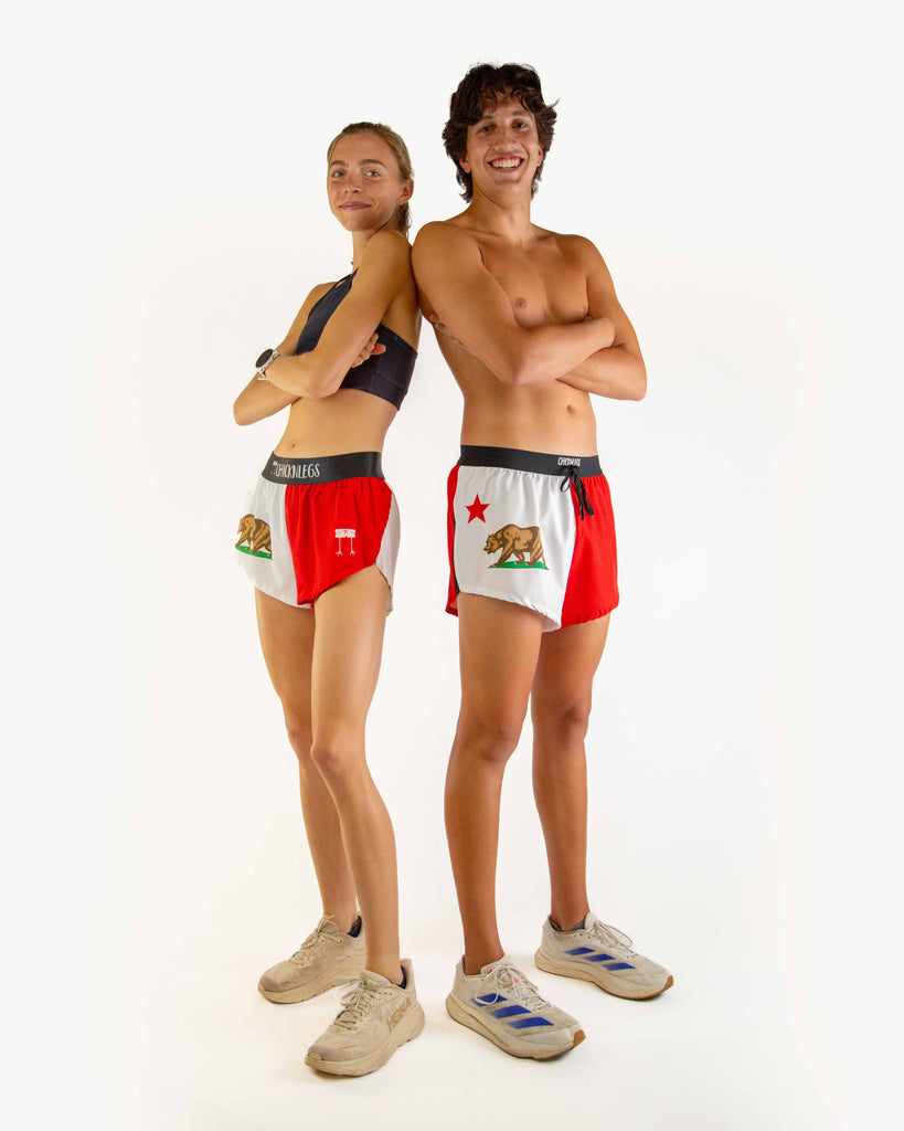 Duo image is shown of two runners wearing ChicknLegs in the men's 2 inch drawstring shorts and the women's 1.5 inch split running short in the California State Flag.