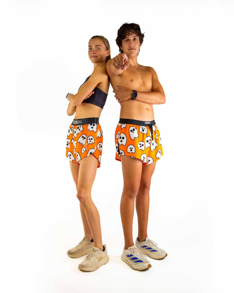 Duo photo is shown of two runners wearing ChicknLegs in the men's 2 inch split running shorts with drawstrings and the women's 4 inch split running shorts.