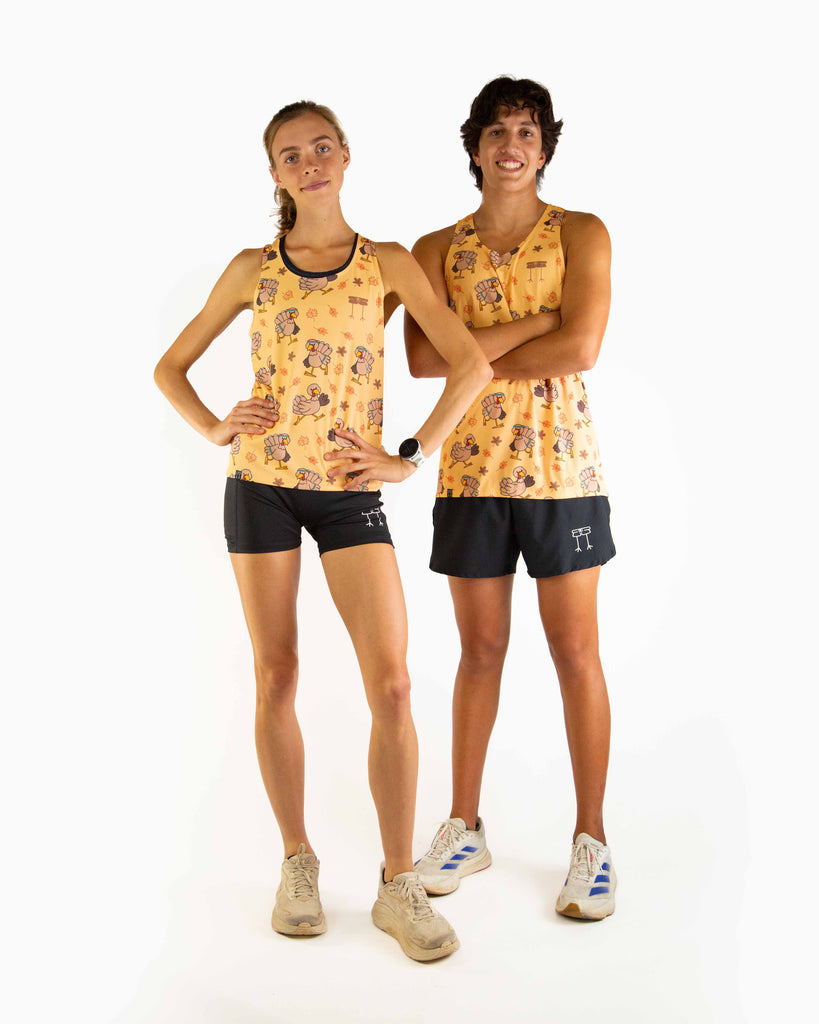 Full body view of models wearing the ChicknLegs Performance Running Singlet, featuring lightweight, breathable construction with mesh back panel and seamless armholes for a comfortable fit, matching with the Pardoned Turkey design and black running shorts.