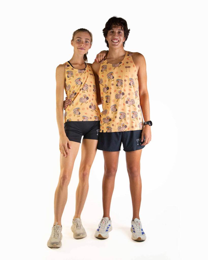 Full body view of models wearing the ChicknLegs Performance Running Singlet, featuring lightweight, breathable construction with mesh back panel and seamless armholes for a comfortable fit, matching with the Pardoned Turkey design and black running shorts.