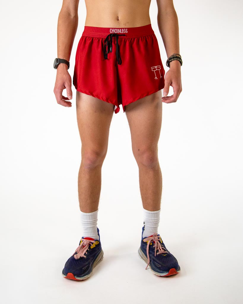 Front view of ChicknLegs men’s 2-inch split running shorts with drawstring, breathable liner, in solid cardinal red.