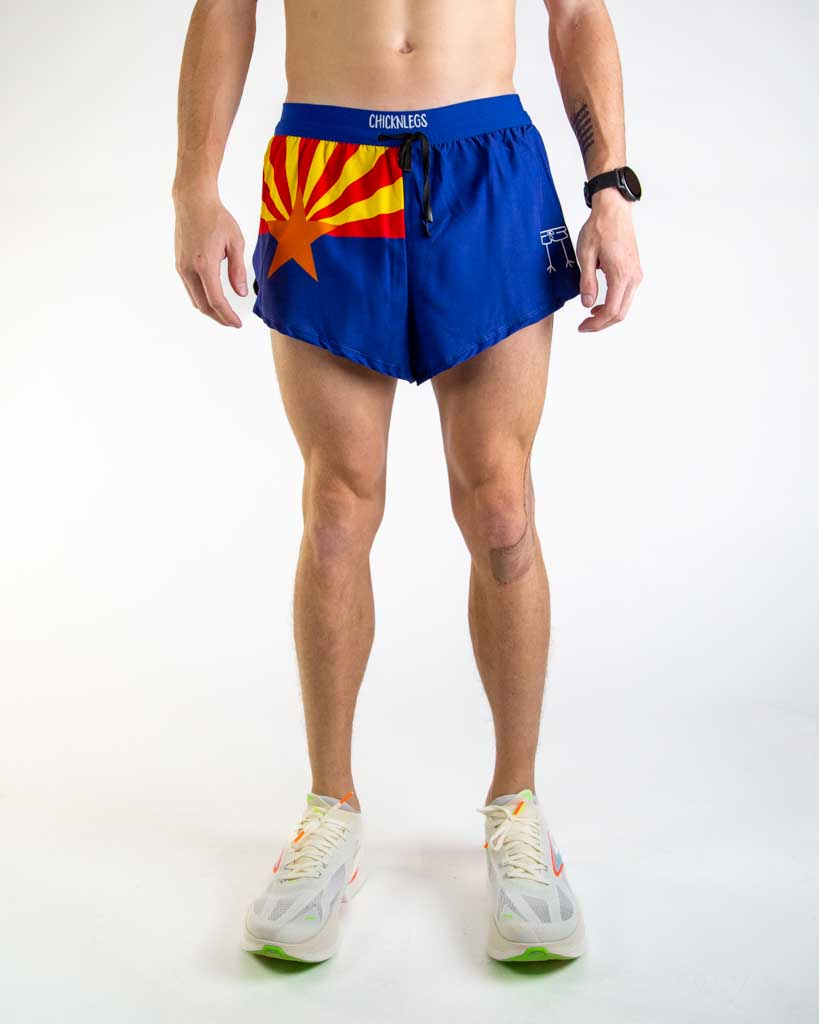 Front view of ChicknLegs Men’s 2-inch DS Split Running Shorts featuring a soft elastic drawstring waistband for a smooth, secure fit and black mesh liner for coverage and breathability. Featured are the Arizona State Flag in the colors red, blue, yellow and orange.