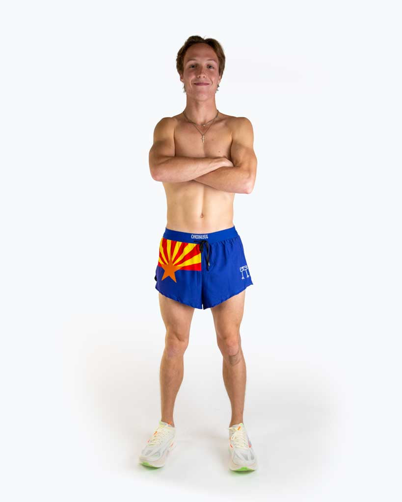 Full body view of model wearing ChicknLegs Men’s 2-inch DS Split Running Shorts featuring a soft elastic drawstring waistband, inner pocket, and black mesh liner for full coverage and breathability.