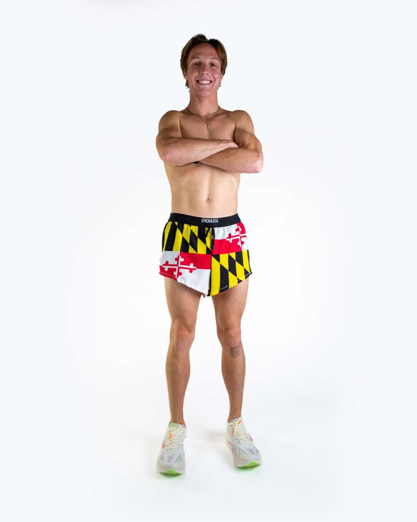 Full body view of model wearing ChicknLegs Men’s 2-inch DS Split Running Shorts featuring a soft elastic drawstring waistband, inner pocket, and black mesh liner for full coverage and breathability.