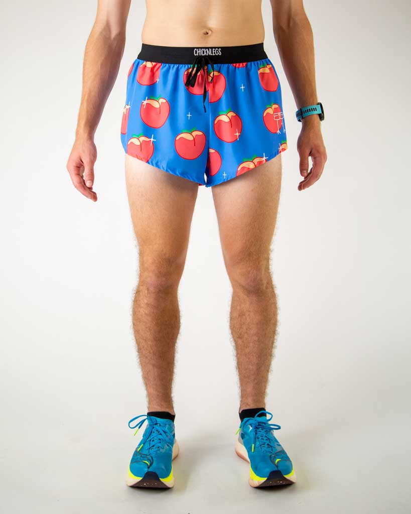 Front view of ChicknLegs men’s 2-inch split running shorts with drawstring, breathable liner, blue background and juicy peaches design.