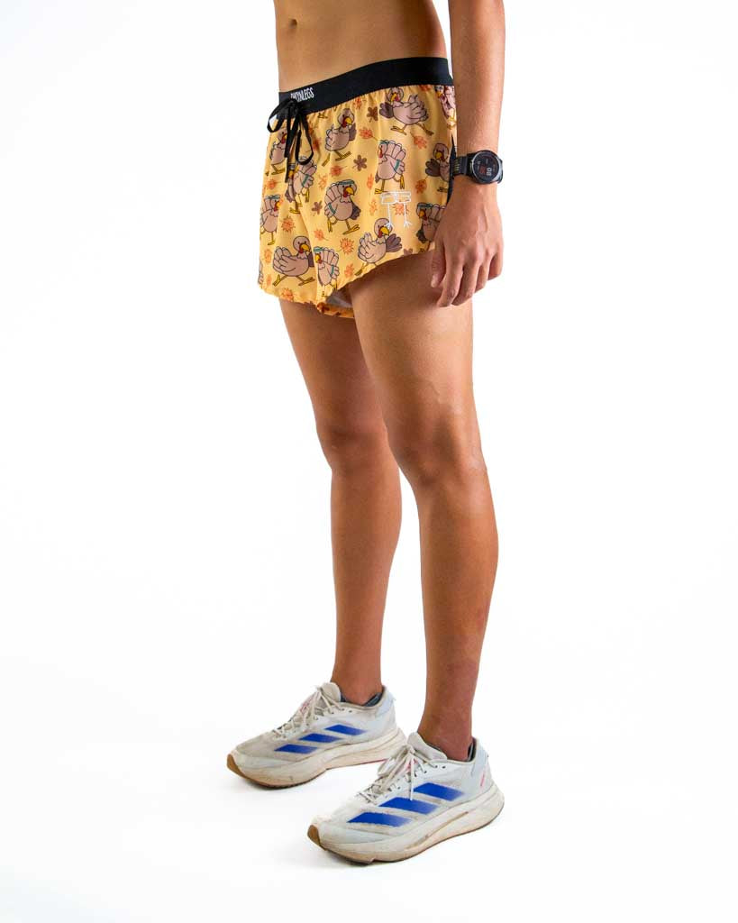 Left side view of ChicknLegs men’s 2-inch split running shorts in, featuring split leg design for running.
