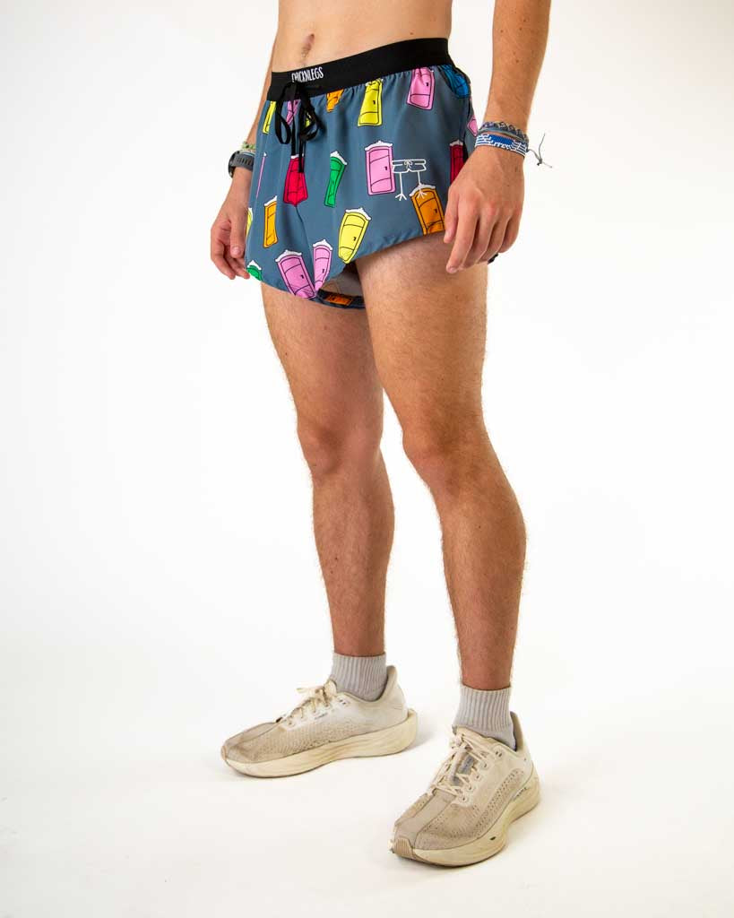 Left side view of ChicknLegs men’s 2-inch split running shorts in blue with colorful porta pottys, featuring split leg design for running.