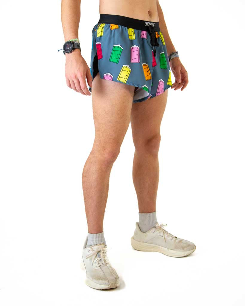 Right side view of ChicknLegs men’s 2-inch hot pink split running shorts with porta pottys and black waistband.