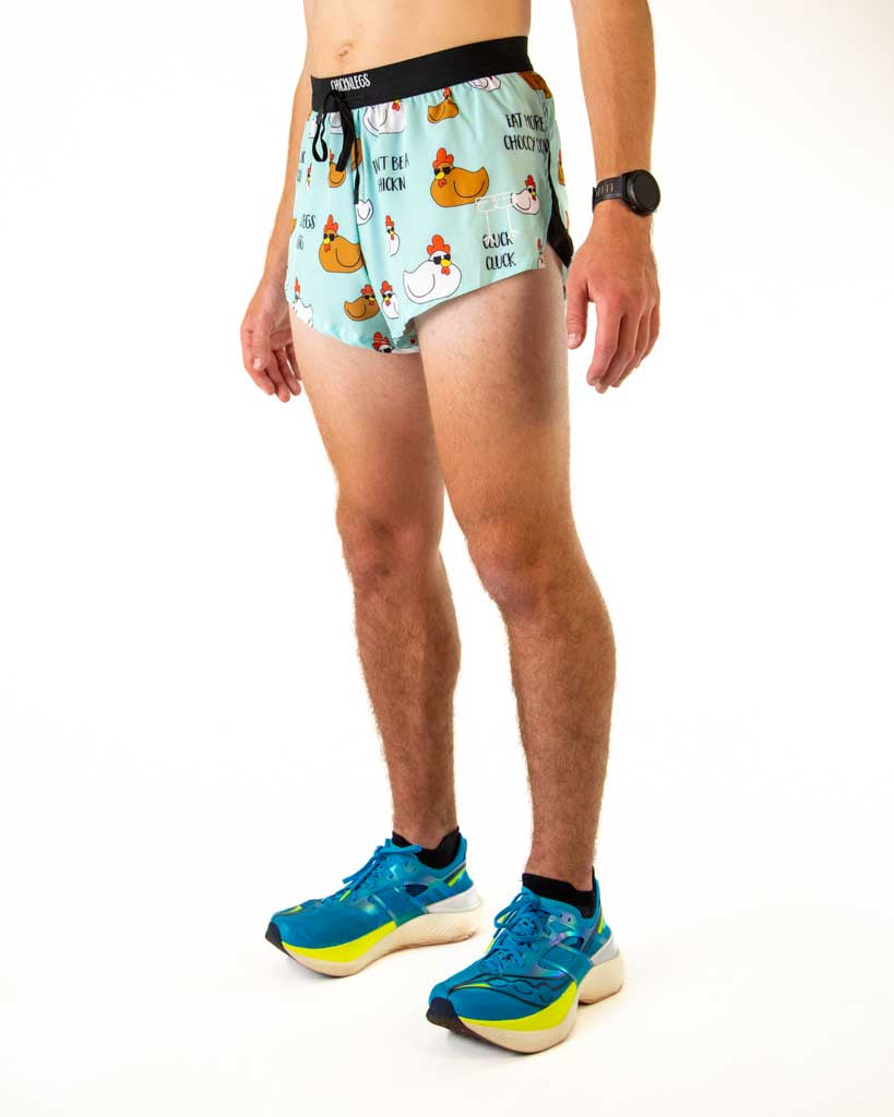 Left side view of ChicknLegs men’s 2-inch split running shorts in light blue with white and brown chickens wearing sun glasses, featuring split leg design for running.