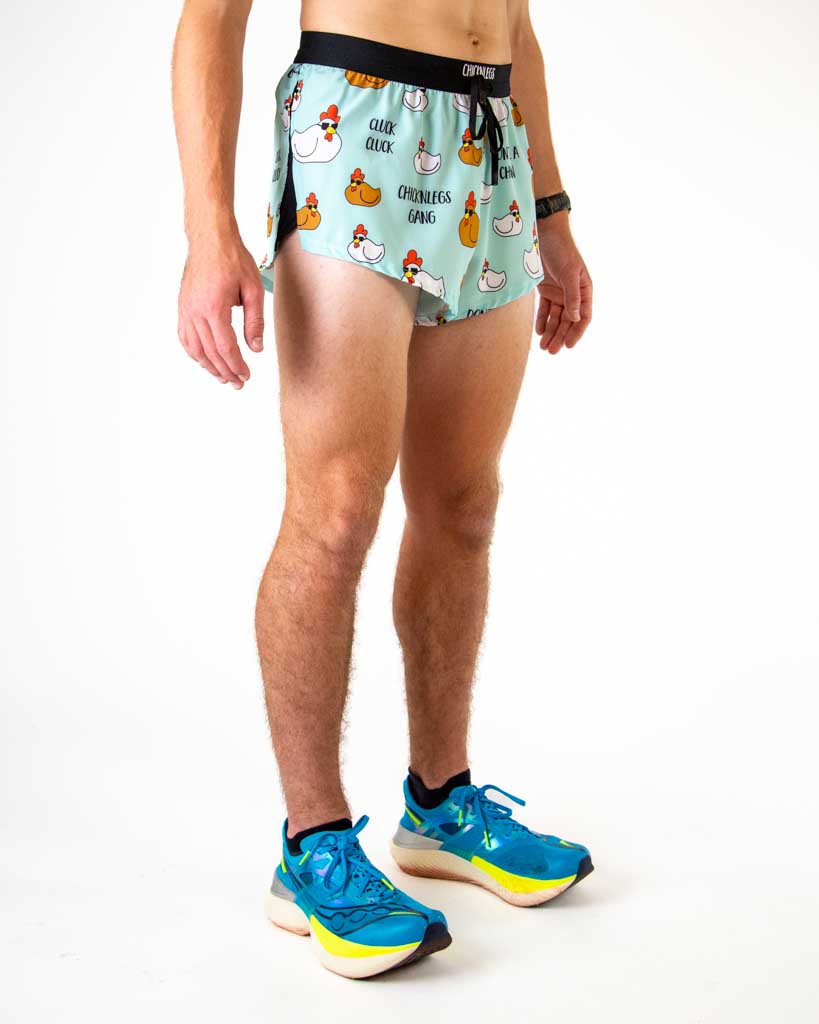 Right side view of ChicknLegs men’s 2-inch light blue split running shorts with white and brown chickens and black waistband.