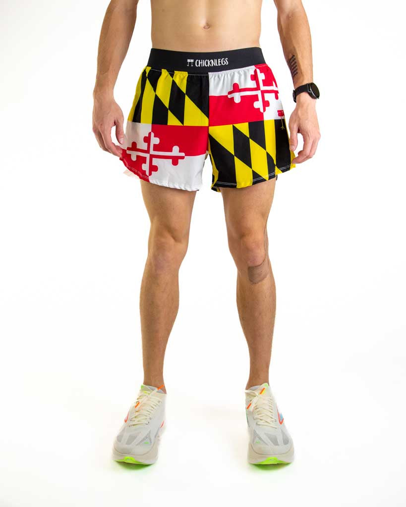 Front view of ChicknLegs men’s 4-inch split running shorts featuring a soft elastic waistband for a secure, smooth fit and black mesh liner for comfort and coverage. Featured is the Maryland State Flag in its red, yellow, white and black colors.