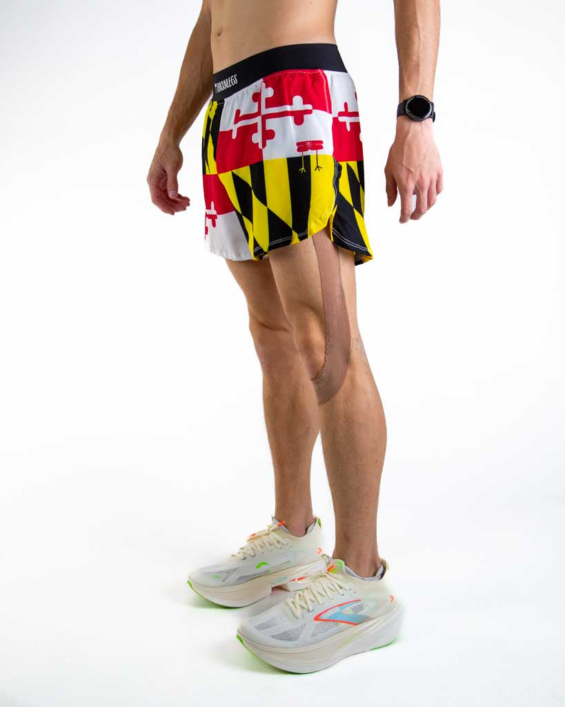 Left side view of ChicknLegs men’s 4-inch split running shorts showing the lightweight design, split leg for mobility, and smooth waistband that stays in place.