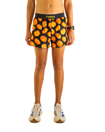 Front view of ChicknLegs men’s 4-inch split running shorts featuring a soft elastic waistband for a secure, smooth fit and black mesh liner for comfort and coverage. Featured in the design is the Pumpkins, matching with black waistband.