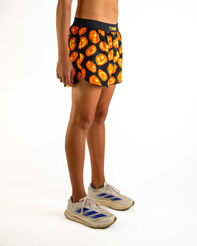 Right side view of ChicknLegs men’s 4-inch split running shorts with soft elastic waistband and breathable black mesh liner visible through the split leg detail.