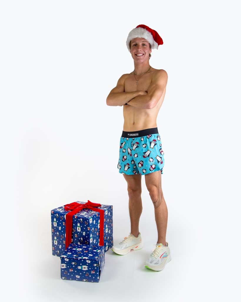 Full body view of model wearing ChicknLegs men’s 4-inch split running shorts featuring a soft elastic waistband, rear zipper pocket, and black mesh liner for full coverage and breathability.