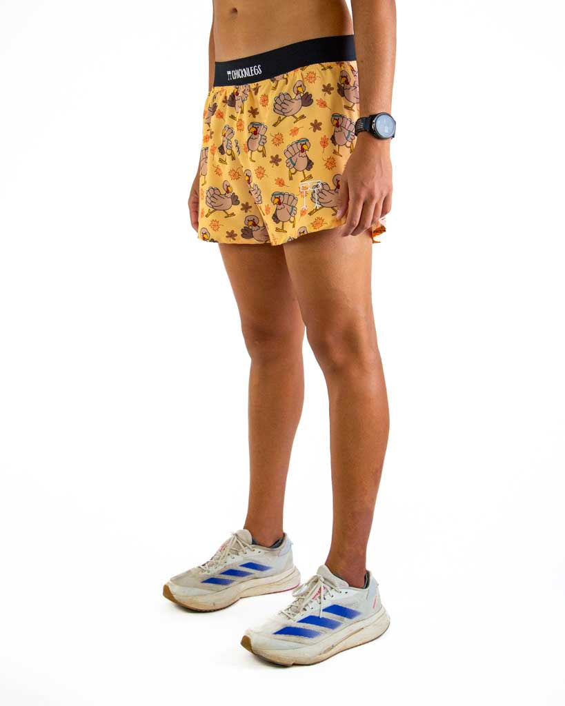 Left side view of ChicknLegs men’s 4-inch split running shorts showing the lightweight design, split leg for mobility, and smooth waistband that stays in place.