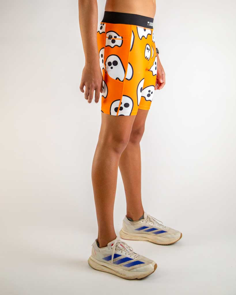 Right side view of ChicknLegs Men’s 8-inch Half Tights highlighting the dual side pockets, supportive mesh liner, and smooth waistband that stays in place during movement.