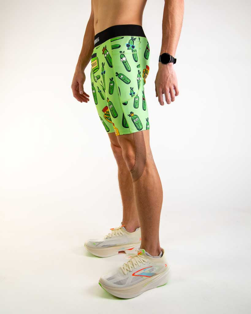 Left side view of ChicknLegs Men’s 8-inch Half Tights showing the streamlined fit, side pocket for essentials, and lightweight stretch fabric designed for performance.