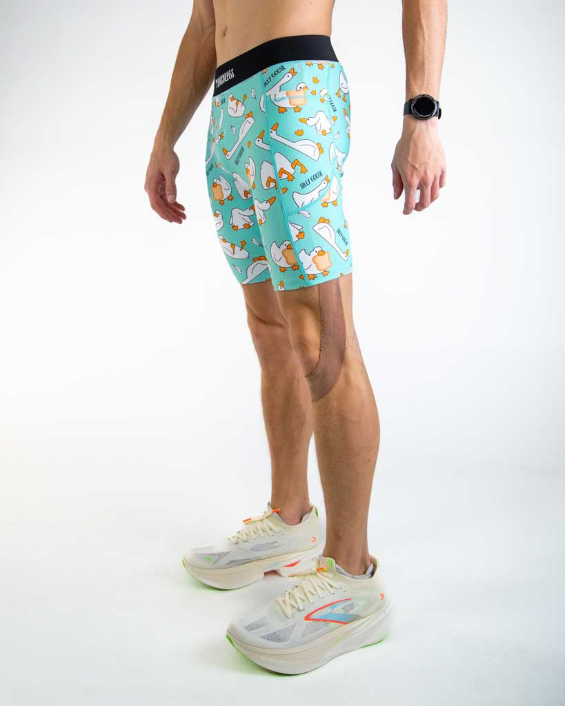 Left side view of ChicknLegs Men’s 8-inch Half Tights showing the streamlined fit, side pocket for essentials, and lightweight stretch fabric designed for performance.