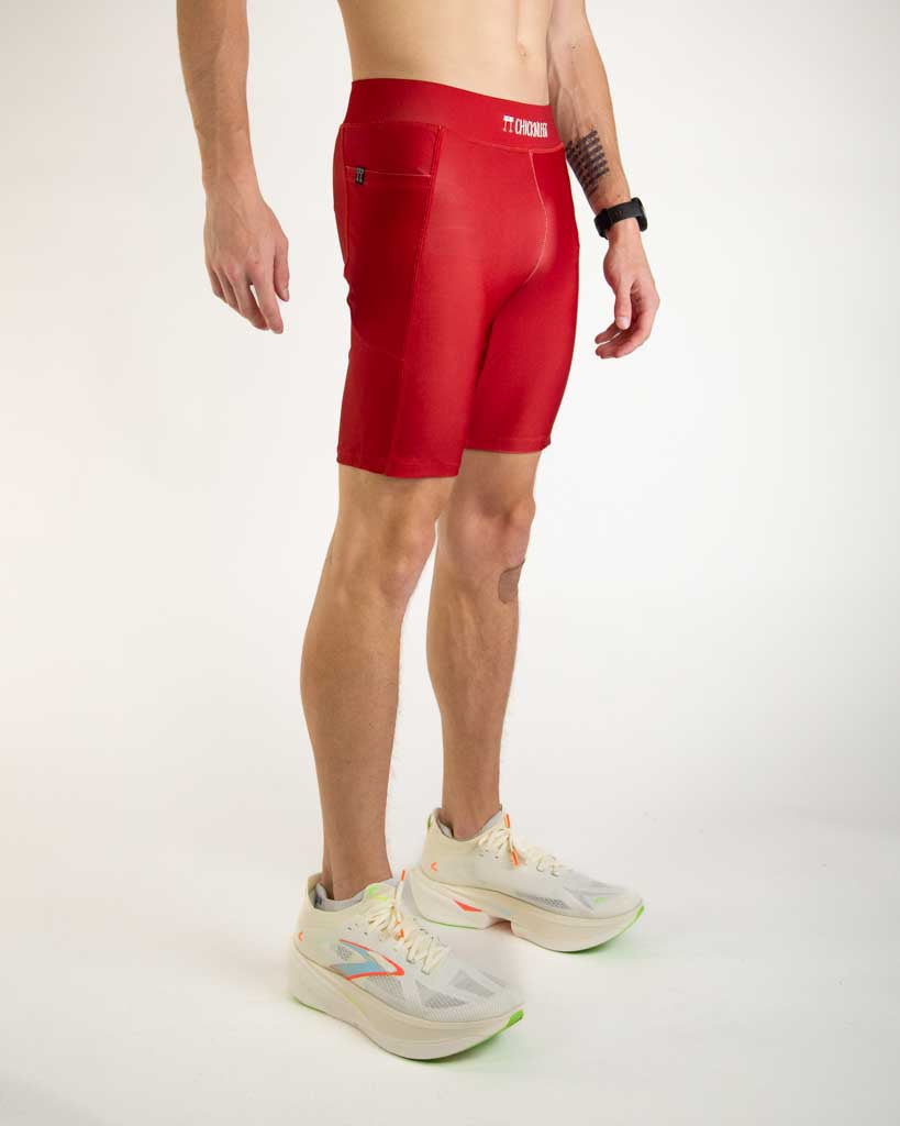 Right side view of ChicknLegs Men’s 8-inch Half Tights highlighting the dual side pockets, supportive mesh liner, and smooth waistband that stays in place during movement.