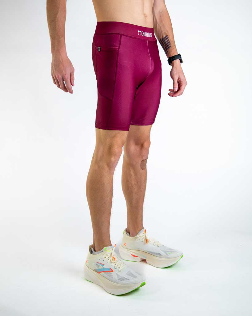 Right side view of ChicknLegs Men’s 8-inch Half Tights highlighting the dual side pockets, supportive mesh liner, and smooth waistband that stays in place during movement.