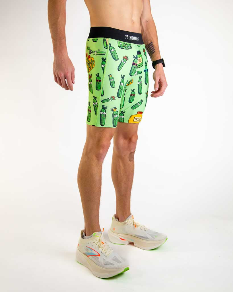 Right side view of ChicknLegs Men’s 8-inch Half Tights highlighting the dual side pockets, supportive mesh liner, and smooth waistband that stays in place during movement.