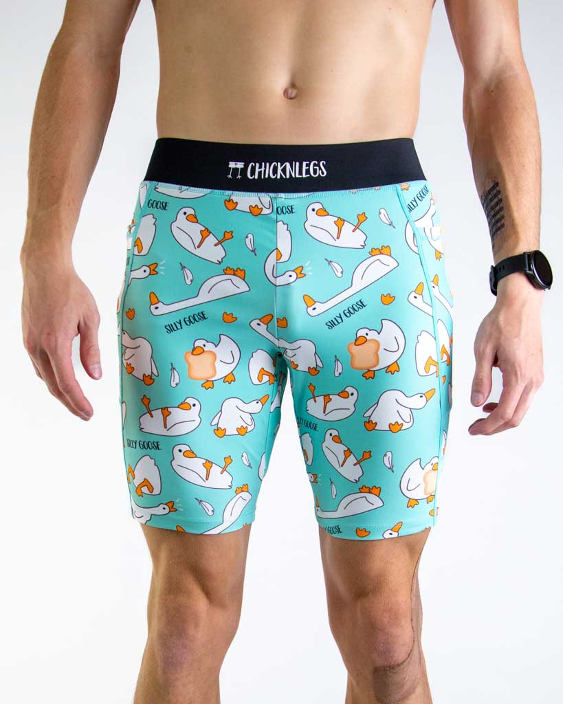Front view of ChicknLegs Men’s 8-inch Half Tights featuring a soft elastic waistband for a smooth, secure fit and black mesh liner for support and comfort. Featured are the Silly Goose design in a light blue background with white gooses!